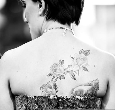 A picture of Lamb and Floral design tattoo of Black Widow.